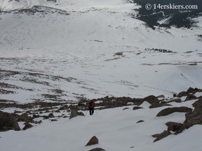 Boot packing to backcountry ski on Mt. Bierstadt.