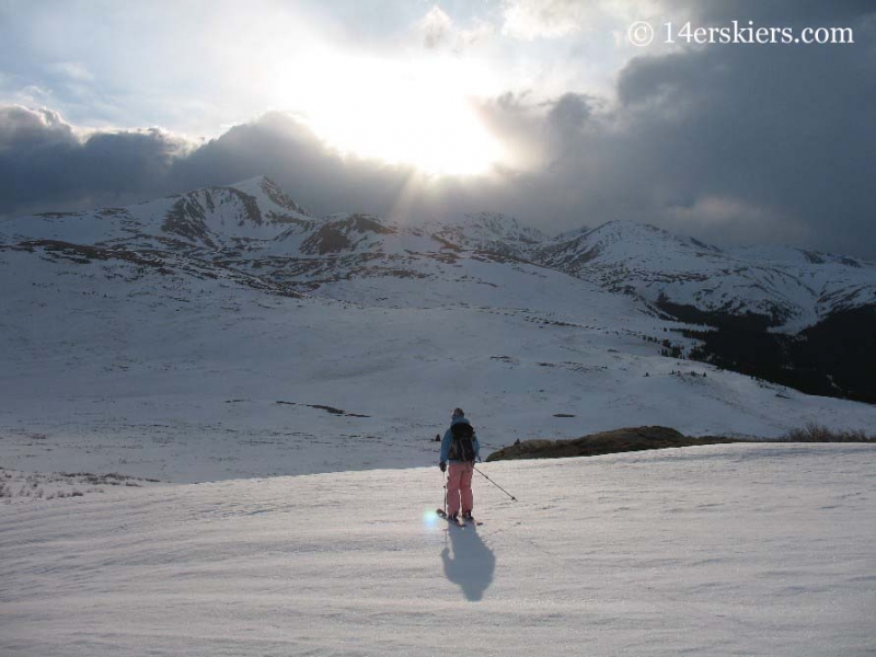 Brittany Walker Konsella skiing off into the sunset on Mt. Bierstadt.