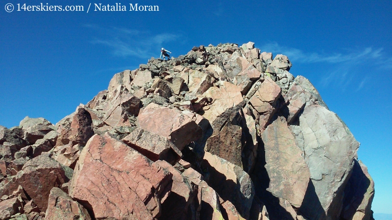 Brittany Konsella downclimbing on Snow Peak. 