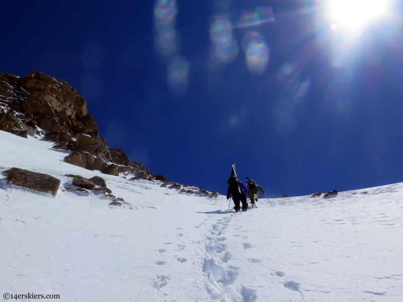 climbing skiers point